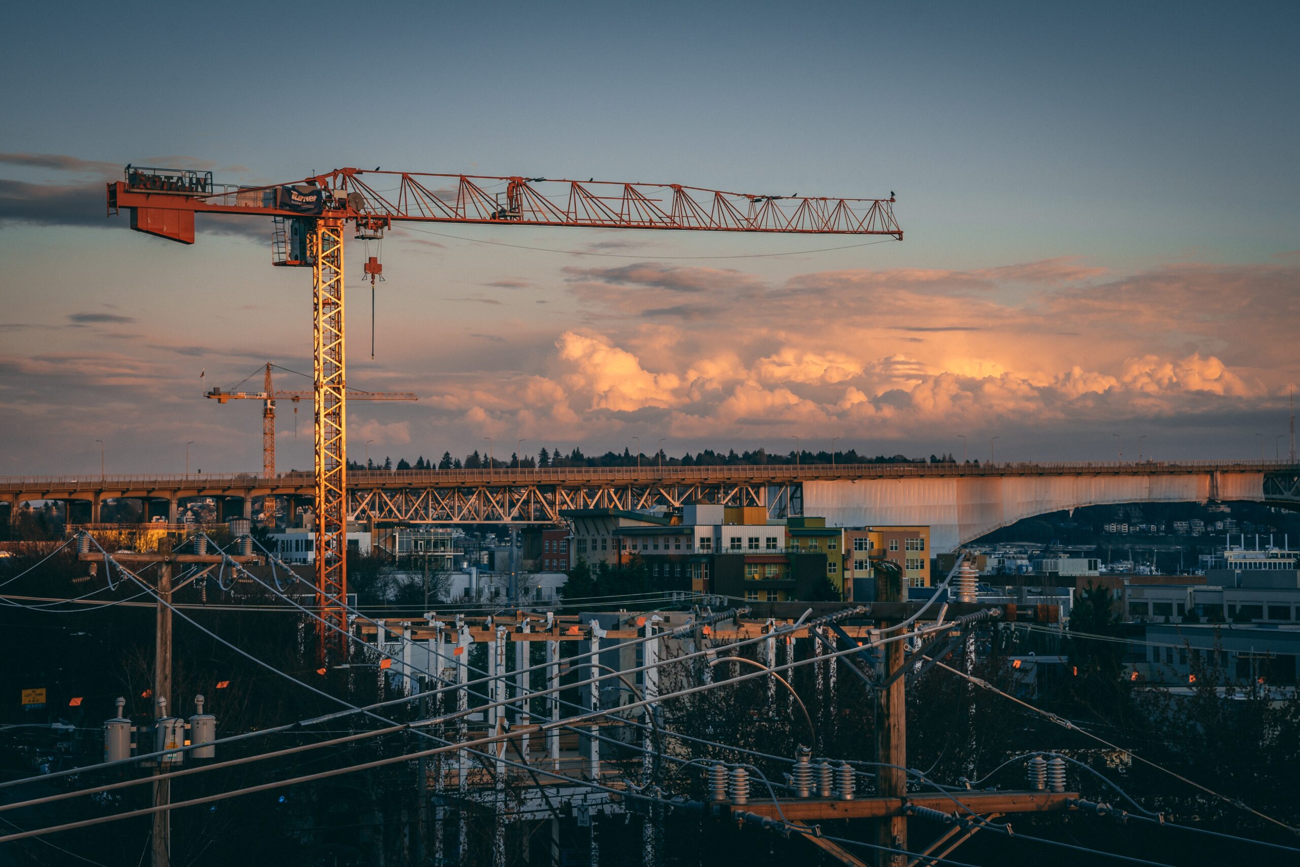 A beautiful view of a construction site in a city during sunset